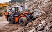 New Loader moving dirt in field,Hitachi Loader moving up with gravel,Loader dropping dirt in truck,Hitachi Wheel Loader moving rocks